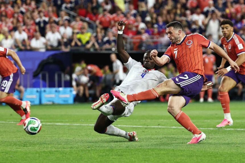 John McGinn berugja a gyoztes golt mikozben az ideges Skocia visszaveri a Haiti kesoi rohamat